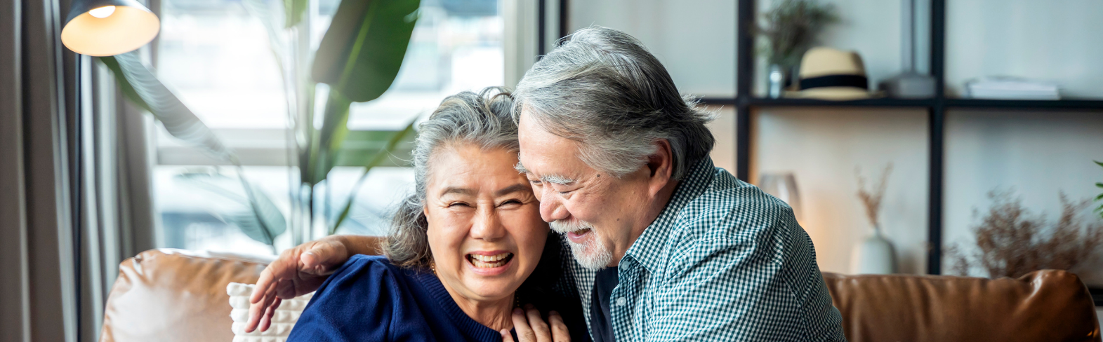 Couple sitting on couch.