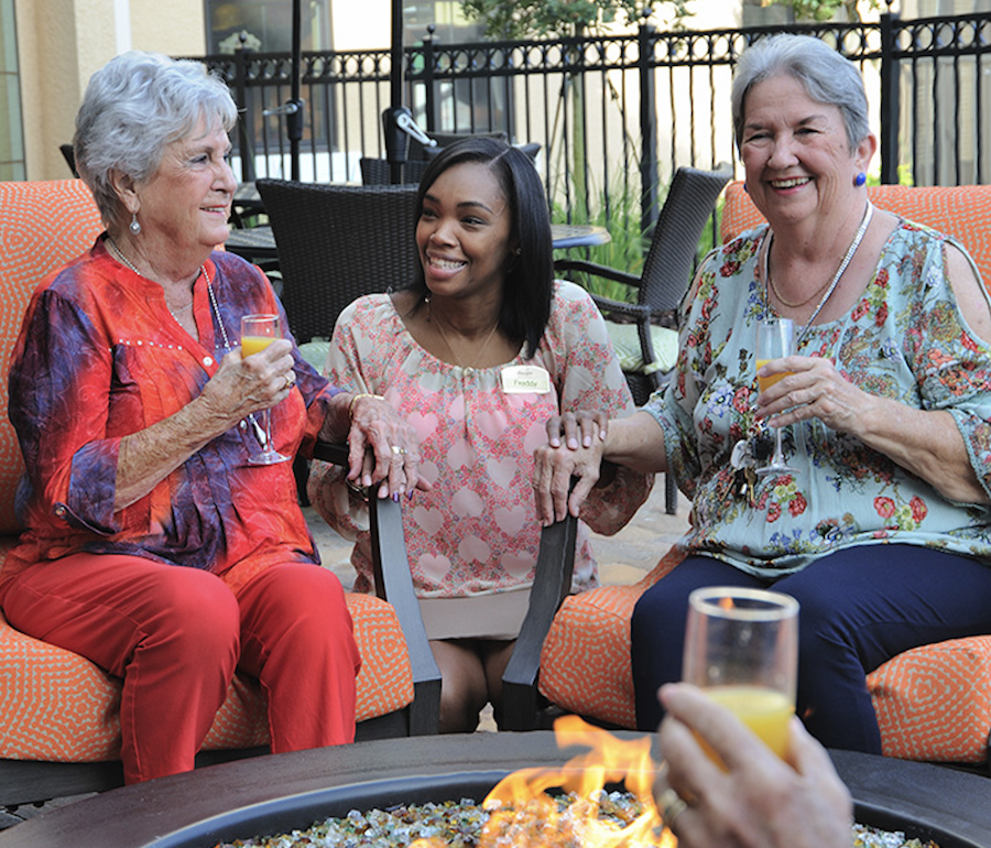 Allegro Associate Happily Chatting with Two Allegro Residents Allegro Associate Happily Chatting with Two Allegro Residents