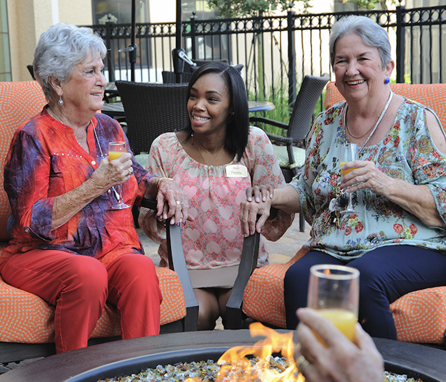 Allegro Associate Happily Chatting with Two Allegro Residents