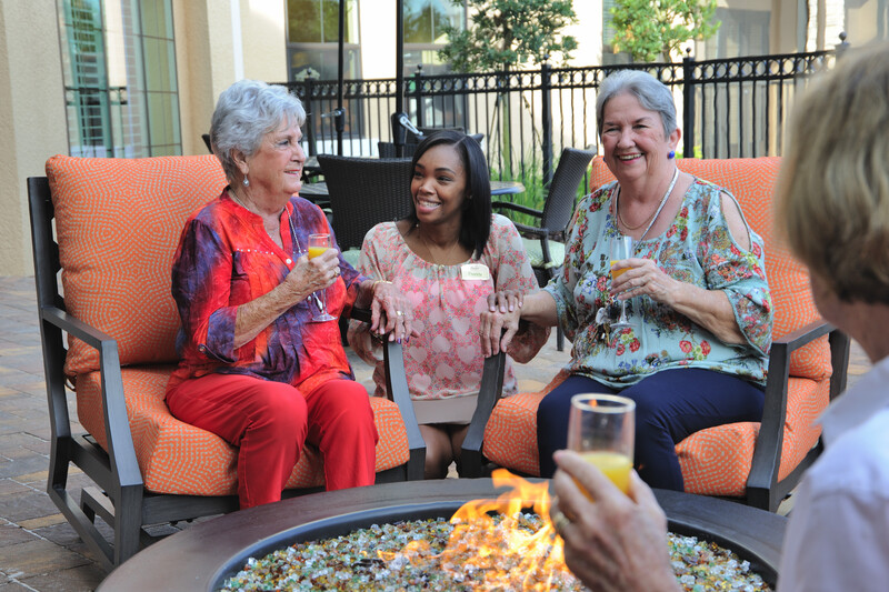 Residents and associate by fire pit